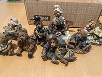 Full view of eight Boyd's Bears figurines arranged on surface