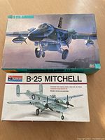 Two boxed airplane scale model kits side by side: Hasegawa FB-111A Aardvark and Monogram B-25 Mitchell.