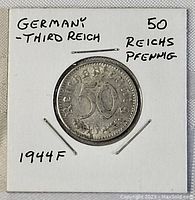 Front side of the 1944 German 50 Reichspfennig coin with denomination and year mint mark.