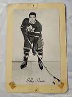 Front view of vintage black-and-white hockey photo card featuring Billy Harris in Toronto Maple Leafs uniform, showing surface wear and discoloration.