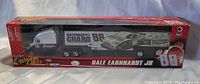Front view of the unopened boxed model showing Dale Earnhardt Jr. NASCAR tractor trailer with National Guard and car number 88 graphics.