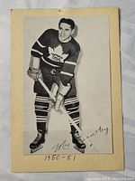 Front view of vintage black and white Max Bentley hockey photo card with Toronto Maple Leafs logo and 1950-51 date, showing some discoloration and wear.