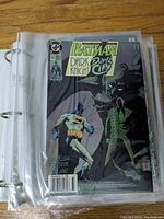Front cover of Batman Dark Knight Dark City comic, issue No 454, in a protective sleeve within binder.