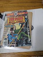 Comic book The Unknown Soldier issue No 200 in protective sleeve showing front cover art and condition.