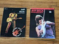 Two sheet music books: Jeff Beck Vocal Guitar Tablature Vol. 2 and Jeff Beck Anthology Guitar Tablature Edition with Jeff Beck playing guitar on covers.