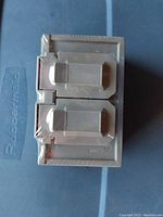 Front view of gray Leviton weather resistant receptacle with rubber covers closed, showing protective features for outdoor use.