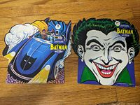 Photo of Batman and Joker shaped 45 record sleeves, colorful and in collectible condition with price tags