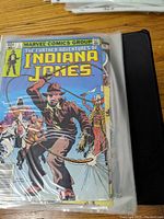 Photo of The Further Adventures of Indiana Jones comic book in protective sleeve, showcasing front cover.
