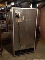 Rear view showing compressor, power cord and ventilation area
