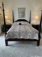 Front view of assembled four-poster bed with bedding