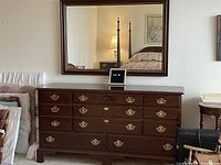 Front view of lowboy dresser with mirror mounted above