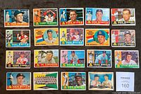 Full overview of 35 Topps baseball cards laid out flat showing front of cards with player portraits and names.