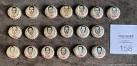 Front view of 19 Coca Cola bottle caps each depicting a black and white portrait of Toronto Maple Leafs players along with the red Coca Cola logo.