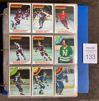 Binder page displaying nine 1978-79 Topps hockey cards featuring players Mike Bossy, Phil Esposito, Guy Lafleur, Darryl Sittler, and others.