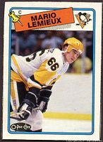 Front of the hockey card showing Mario Lemieux in Penguins uniform with O-Pee-Chee branding and design from 1988-89 series.