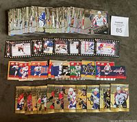 Large assortment of hockey cards shown in multiple rows: the top row contains the base set cards, below are strips of Season Highlights inserts, colorful Die Cuts, and gold Shining Futures inserts.