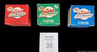 Three factory box sets of Fleer Classic Miniature baseball cards from 1986, 1987, and 1988. Red, green and blue colored boxes with some handling wear visible on the edges.