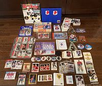 Full overview of the hockey card lot, sets, inserts, sticker albums, and memorabilia spread out on the floor
