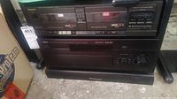 Front view showing Technics RS-T18 double cassette deck with cassette slots and control buttons, Yamaha amplifier below it