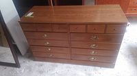 Front view of the Ethan Allen wood dresser showing all six drawers and drawer pull details.