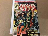 Front cover of Iron Fist #10 comic book showing action scene with Iron Fist character and price details.