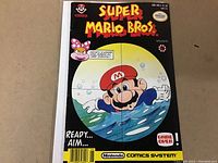 Front cover of the Super Mario Bros. issue #5 comic showing Mario underwater aiming as viewed through a scope.