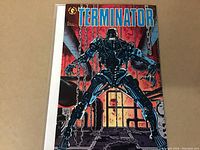 Front cover of "Terminator" issue #4 comic book showing a metallic Terminator robot in industrial background with chains and red sky.