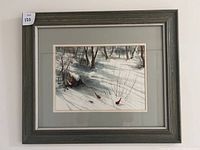 Full view of the framed snow scene painting with trees and birds