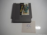 Front view of the Metal Gear NES cartridge with label and number 55 note.
