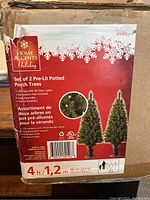 Box front label showing brand, product name, features and tree photos