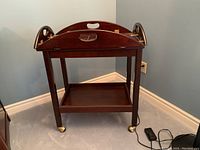 Bar cart with removable tray in place, showing overall condition and presence of casters.