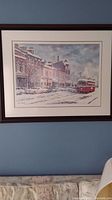 Photo of the framed limited edition print showing the streetcar on snowy street with historic buildings in background.