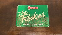 Front of the green box with Donruss logo, The Rookies title, 1990 puzzle and cards text