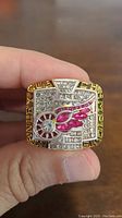 Front of replica ring showing Detroit Red Wings logo with rhinestones.