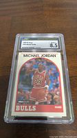 Front view of the graded Michael Jordan basketball card showing the player in a red Bulls jersey with number 23 and card details.