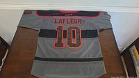 Full back view of the Montreal Canadiens Guy Lafleur Black Ice Reebok jersey laid flat showing full name and number 10.