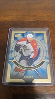 Photo of Jonathan Huberdeau rookie hockey card featuring him in a Florida Panthers uniform, encased in a protective plastic case.