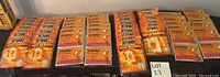 Photo of multiple Hot Hands hand warmer packs laid out on table, showing quantity and packaging