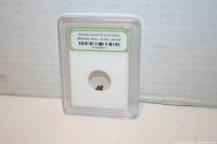 Front view of Roman Widow's Mite sized bronze coin encapsulated in a plastic slab holder with label showing coin details.