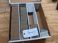 Photo showing boxes with multiple groups of vintage Bowman baseball cards stored inside.