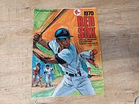 Cover page of the 1970 Boston Red Sox program featuring an illustrated batter at Fenway Park.