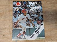 Cover of the 1975 Boston Red Sox Diary of a Winner World Series Edition program with a photo of a batter in action and title text.
