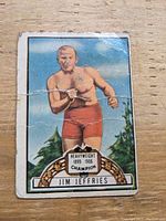 Front of 1951 Topps Ringside boxing card showing Jim Jeffries in red boxing shorts, with Heavyweight Champion banner and card number 54.
