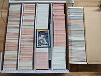 Box full of organized Donruss baseball cards from 1980s-1990s, arranged in vertical stacks.