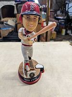 Front view of Fred Lynn bobblehead showing batting pose, uniform, and base plaque
