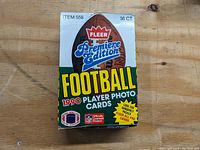 Front view of the unopened box showing 1990 Fleer Premiere Edition football cards logo and branding with text indicating 36 player photo cards.