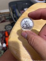 Front side of the Canadian $20 silver coin showing the wolf design and inscriptions.