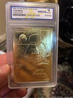 Front of 1996 Star Wars A New Hope trading card embossed in 23kt gold with Darth Vader image, encased in graded holder.