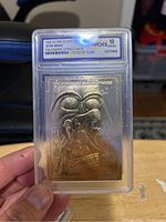 Front of 1990 Star Wars Empire Strikes Back 23k gold limited edition collectible card graded 10 by WCG in protective slab.