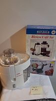 Bonjour Riviera Café Set juice extractor placed beside the Bonjour Riviera Café Set boxed packaging